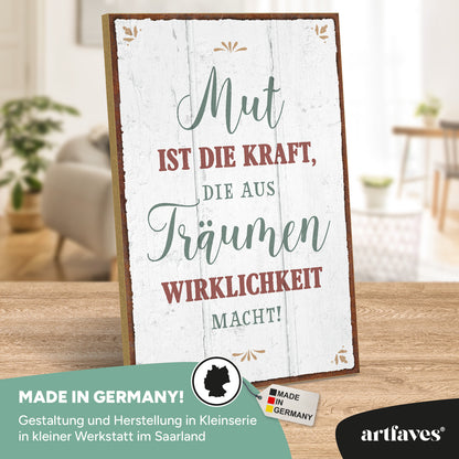 schild-mit-spruch-mut-ist-die-kraft-die-aus-traeumen-wirklichkeit-macht