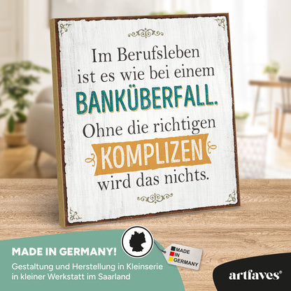 schild-mit-spruch-im-berufsleben-ist-es-wie-bei-einem-bankueberfall