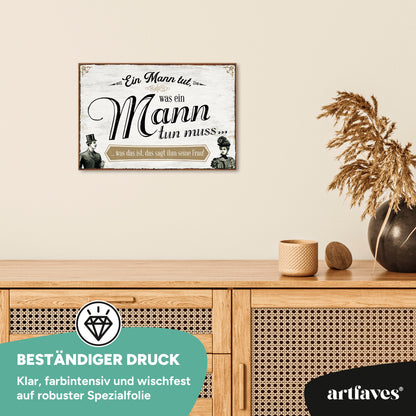 schild-mit-spruch-ein-mann-tut-was-ein-mann-tun-muss